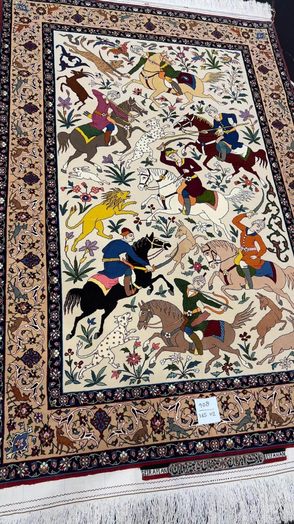 Seirafian rug from Isfahan with a silk foundation and lifelike hunting designs.
